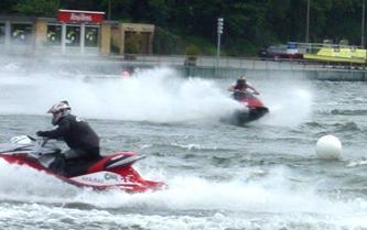 Two jetskiers in action