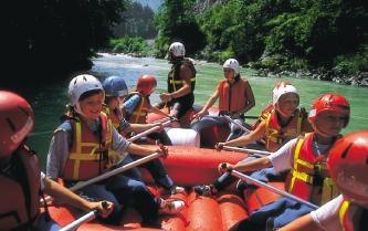 Rafting party with safety equipment