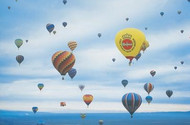 A host of brightly coloured hot-air balloons taking to the skies