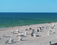 Wicker beach chairs on the beach in Kampen
